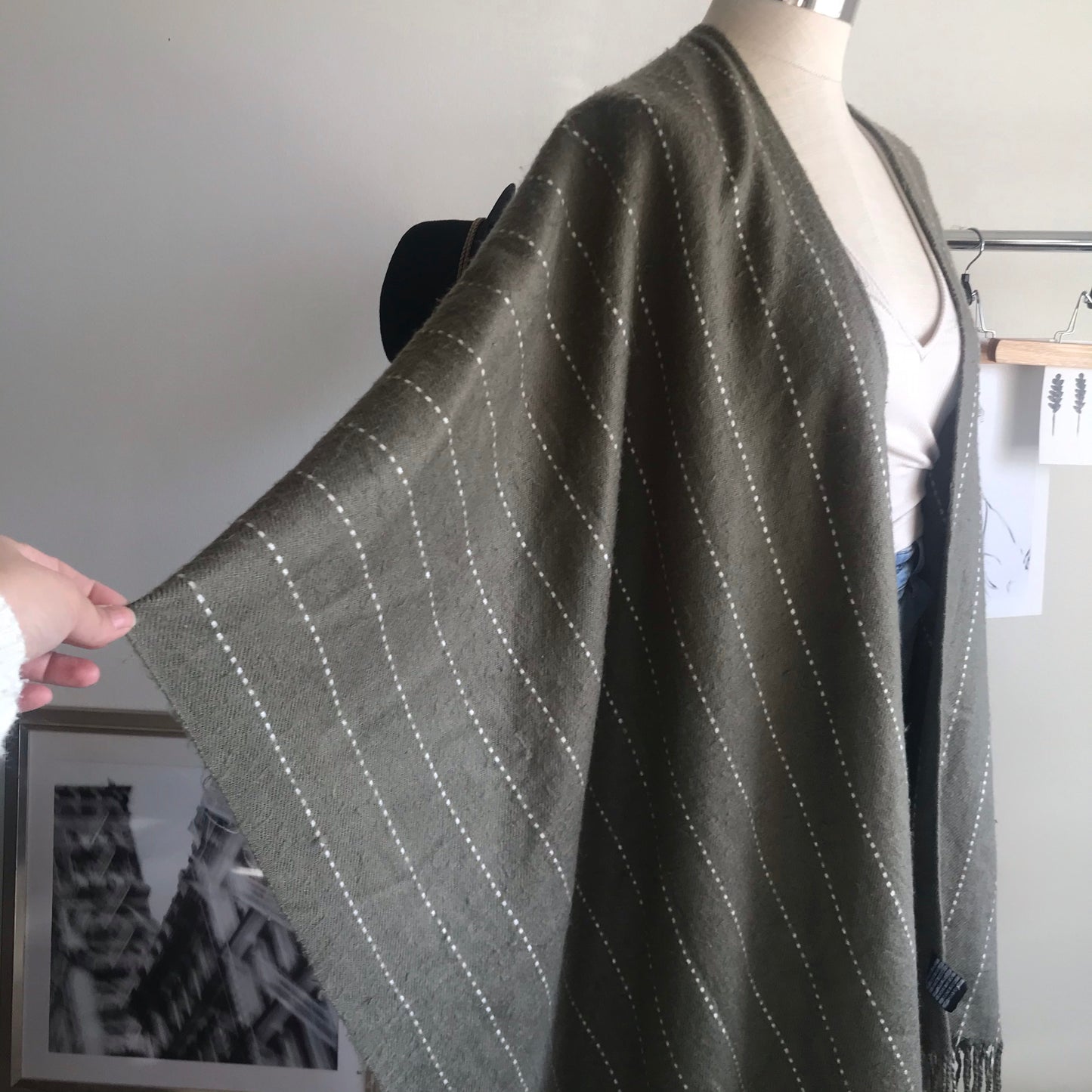 Olive green and white striped poncho. One size.