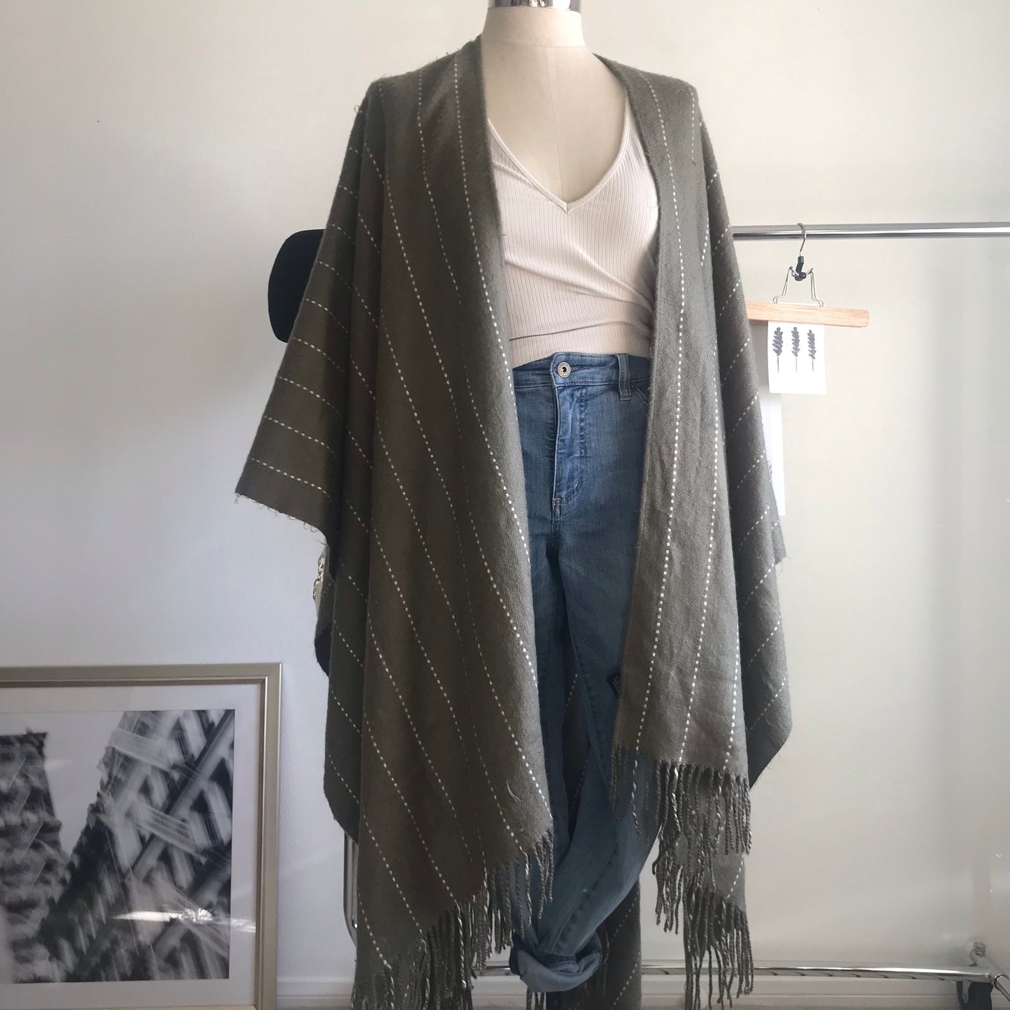 Olive green and white striped poncho. One size.